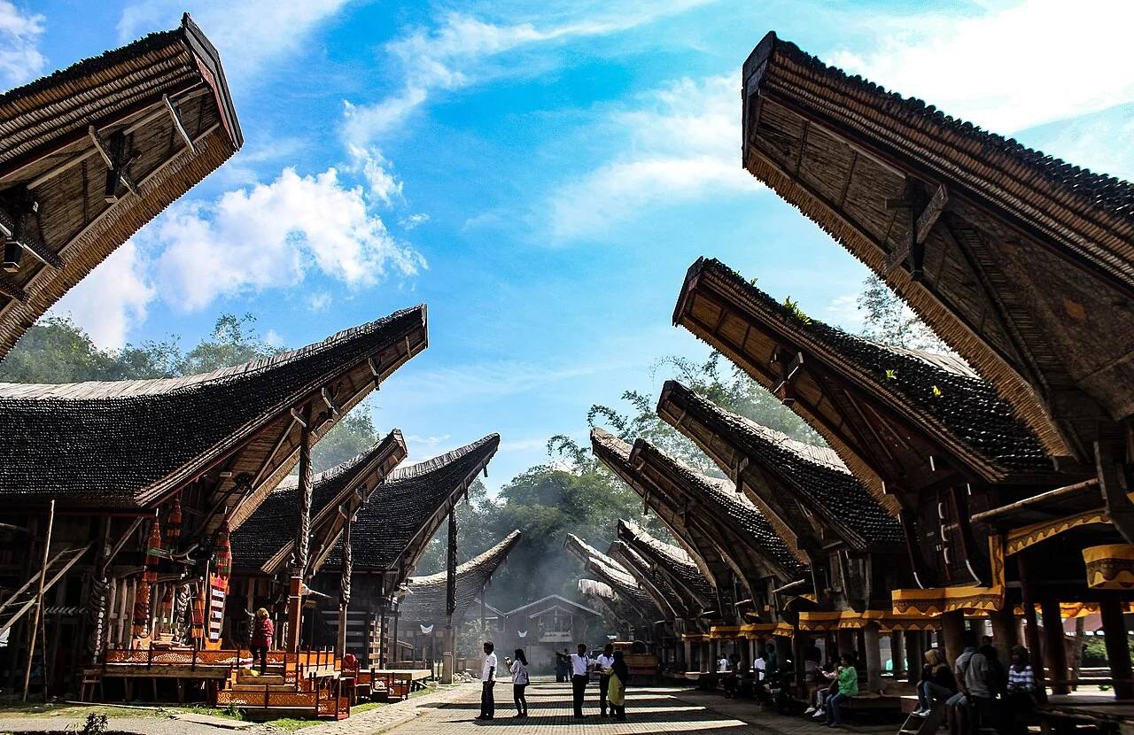 Sweeping tongkonan roofs facing one another at Kete Kesu